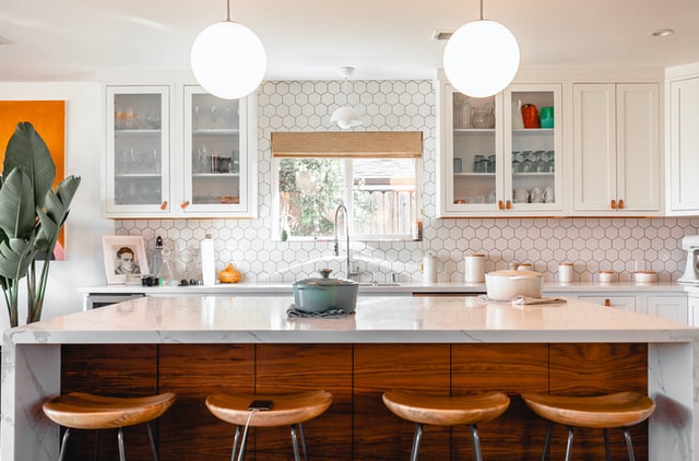 Kitchen with a sink under the window and many light sources